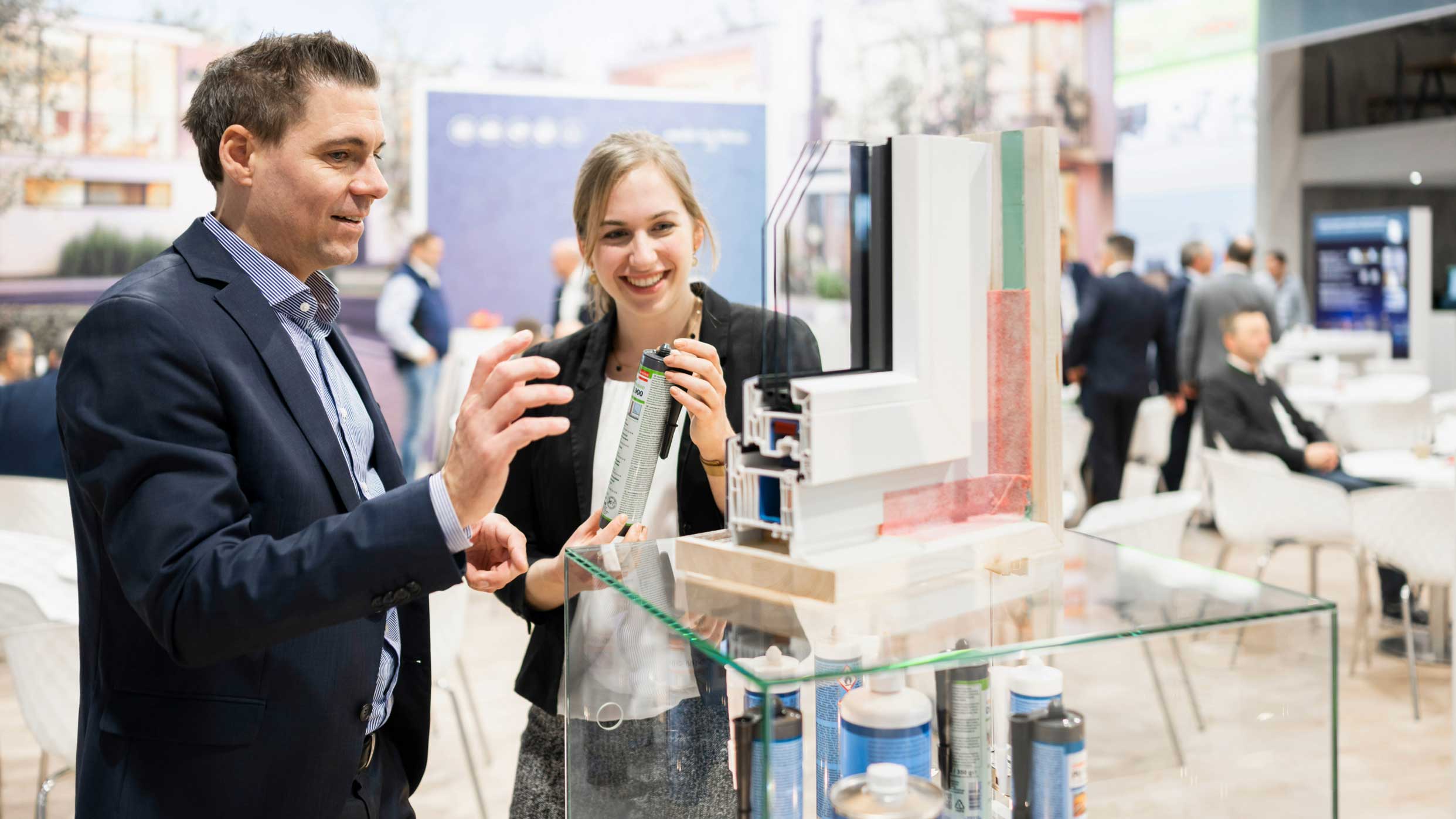 A man is presenting a product to a visitor